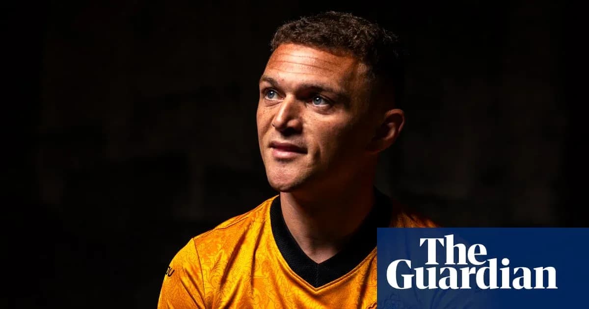 Football player wearing orange jersey in studio Football player wearing orange jersey in studio