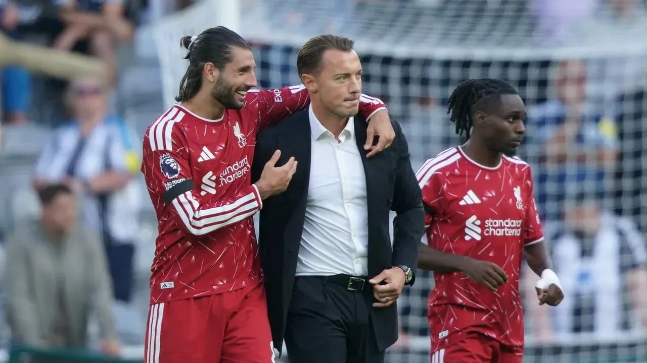 Liverpool players celebrating with their manager after match Liverpool players celebrating with their manager after match