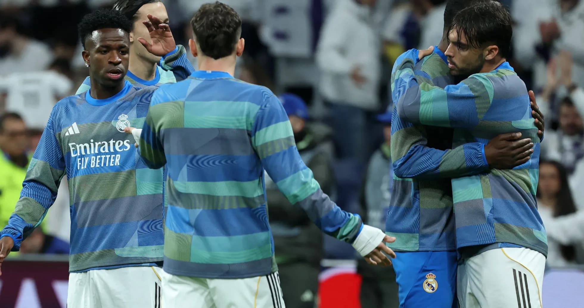 Real Madrid players warming up and embracing each other Real Madrid players warming up and embracing each other