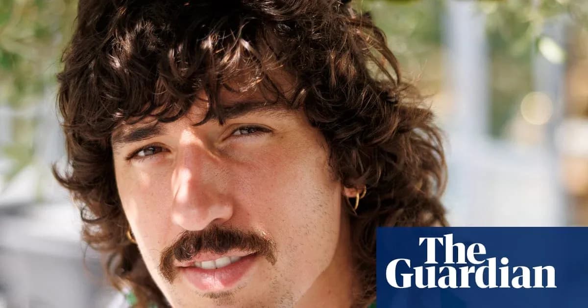 Close-up of a man with curly hair and mustache Close-up of a man with curly hair and mustache