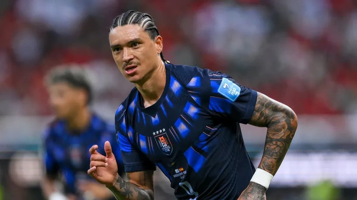 Player in blue jersey running on the field Player in blue jersey running on the field