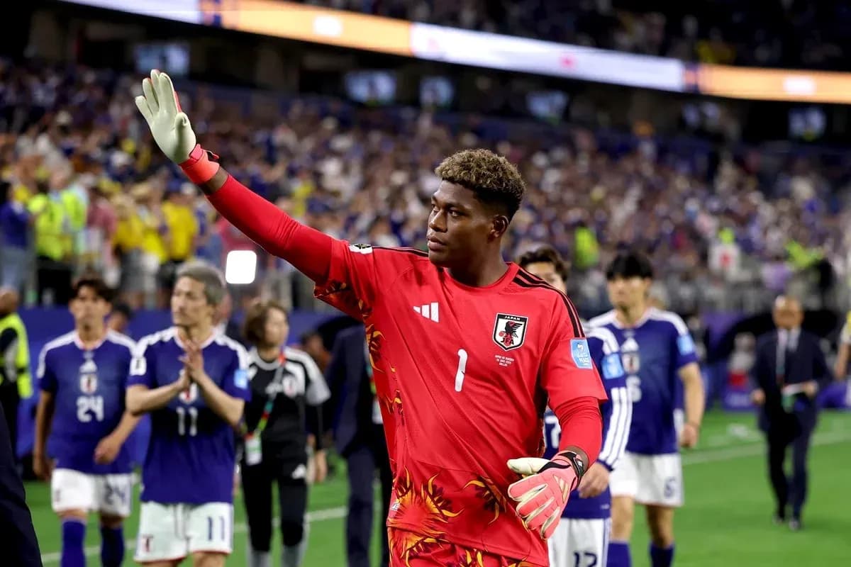 Japanese goalkeeper waving after match with teammates Japanese goalkeeper waving after match with teammates