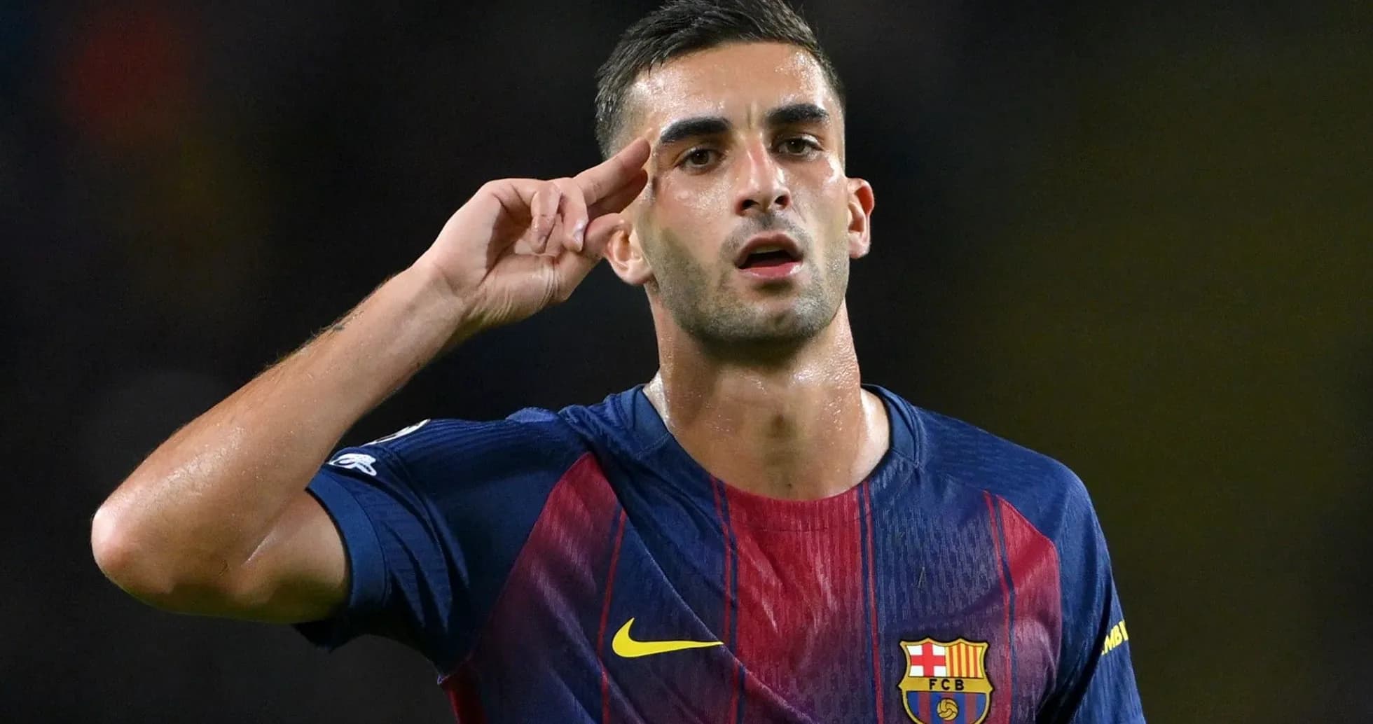 Player saluting while wearing FC Barcelona jersey Player saluting while wearing FC Barcelona jersey