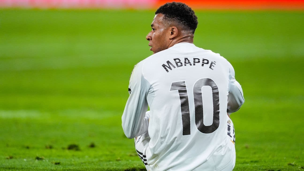 Player wearing jersey with 'MBAPPE' and number 10 Player wearing jersey with 'MBAPPE' and number 10