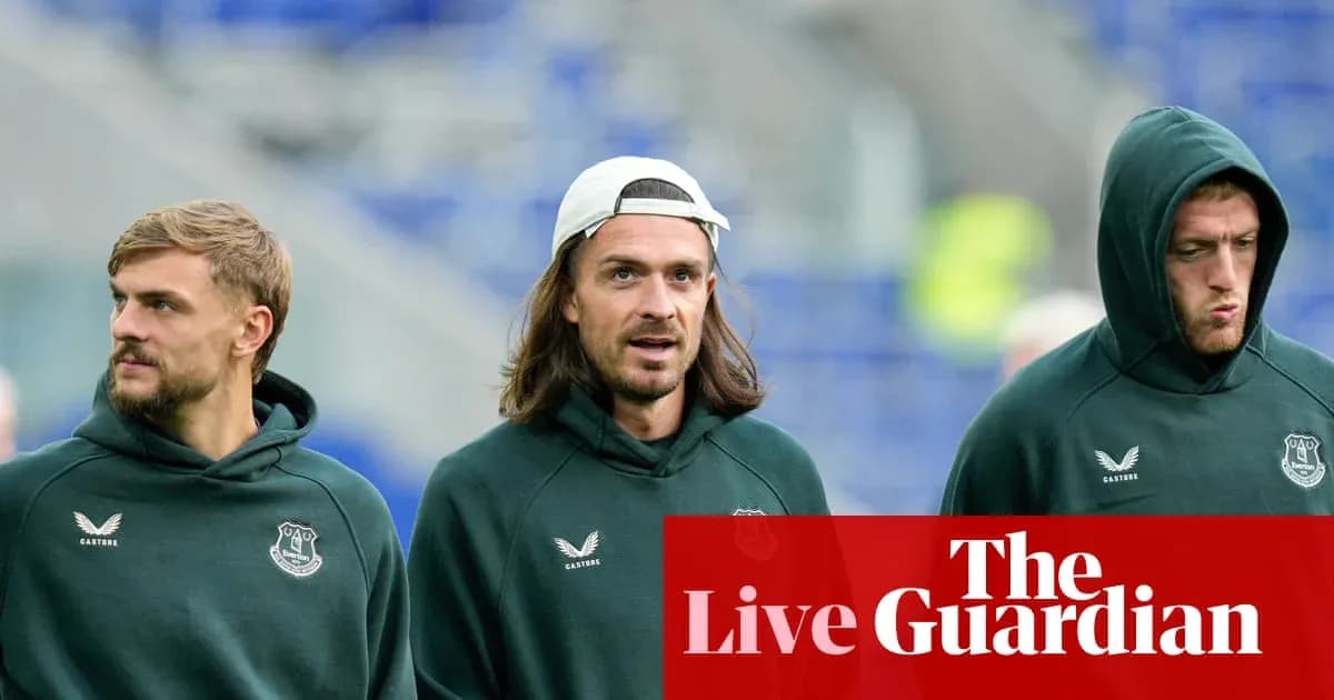 Three players walking in Everton training gear Three players walking in Everton training gear