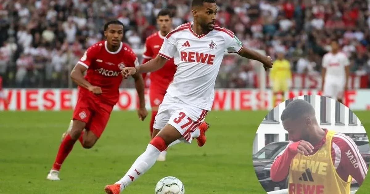 Player in white jersey dribbling during match Player in white jersey dribbling during match