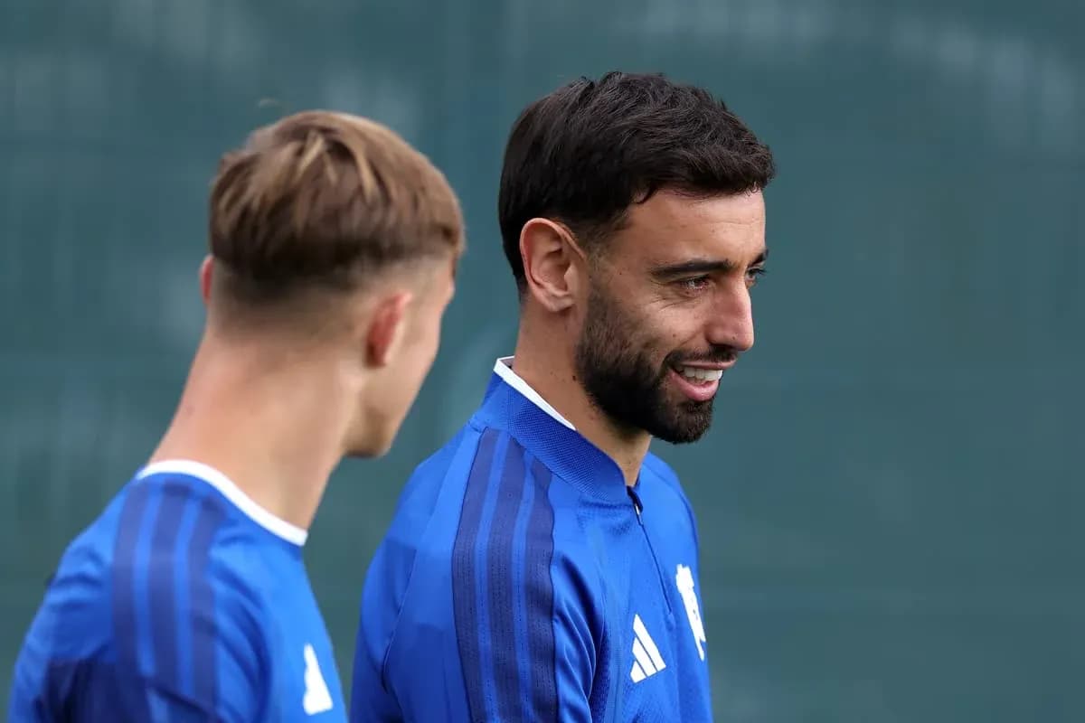 Two players in blue kits during training session Two players in blue kits during training session