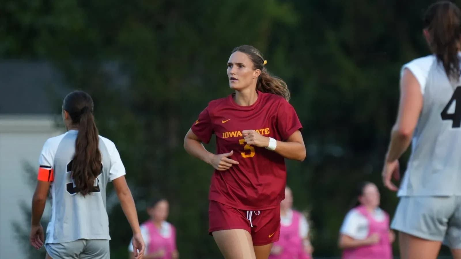 Iowa State player running on the soccer field Iowa State player running on the soccer field