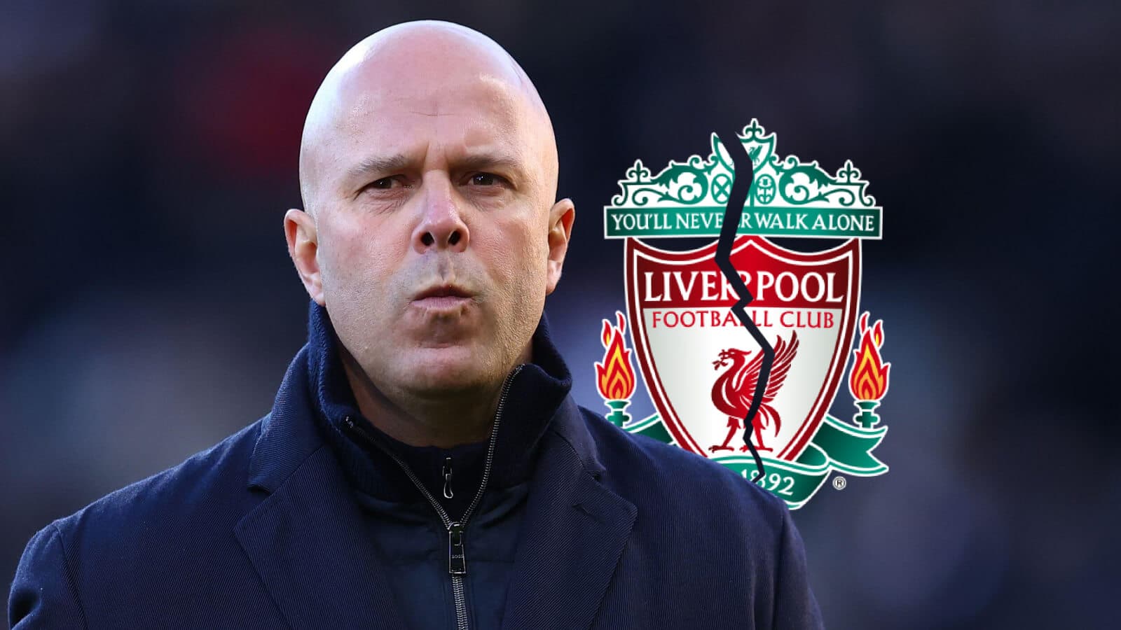Man in suit with Liverpool FC logo in background Man in suit with Liverpool FC logo in background