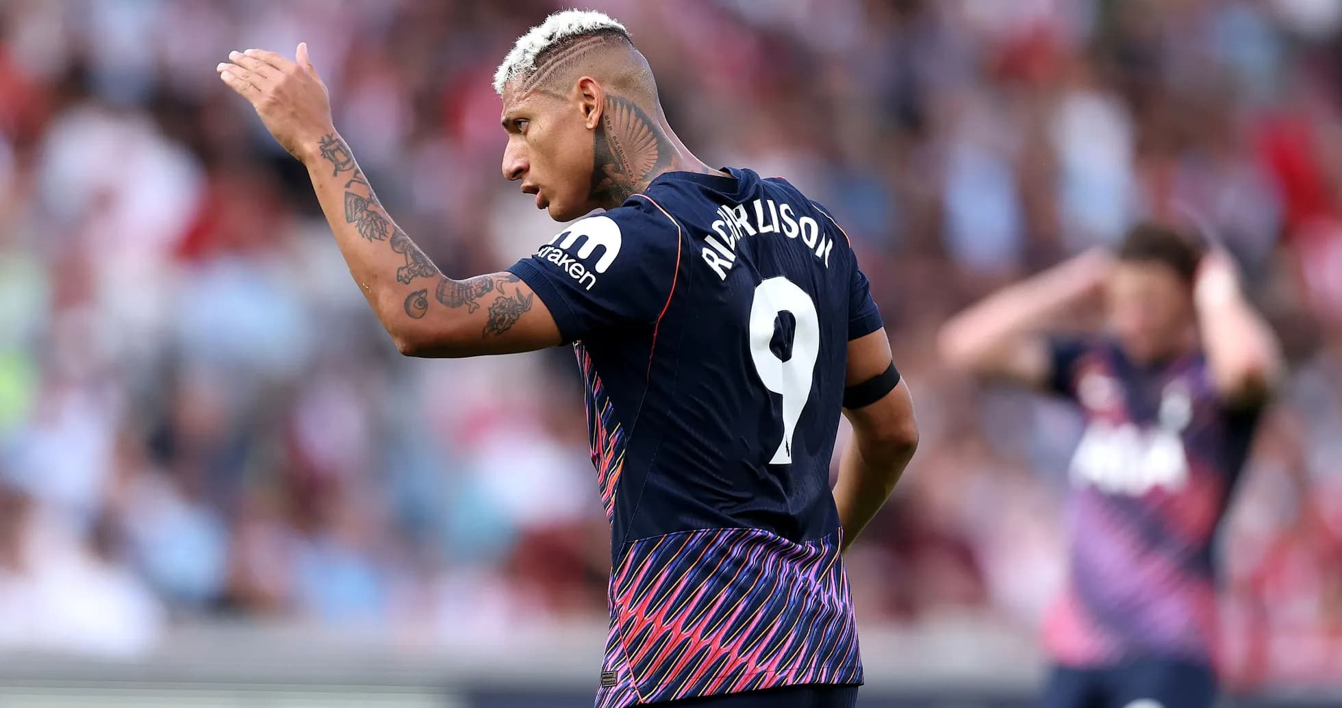 Richarlison gesturing during a football match Richarlison gesturing during a football match