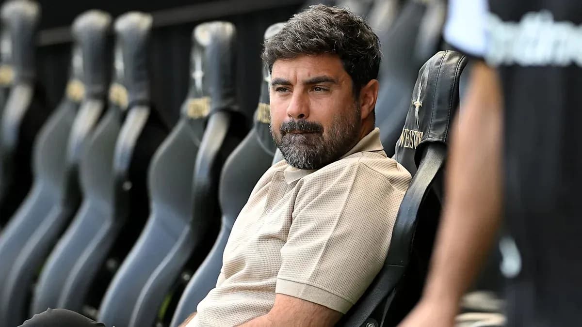Coach seated on bench during match preparation Coach seated on bench during match preparation