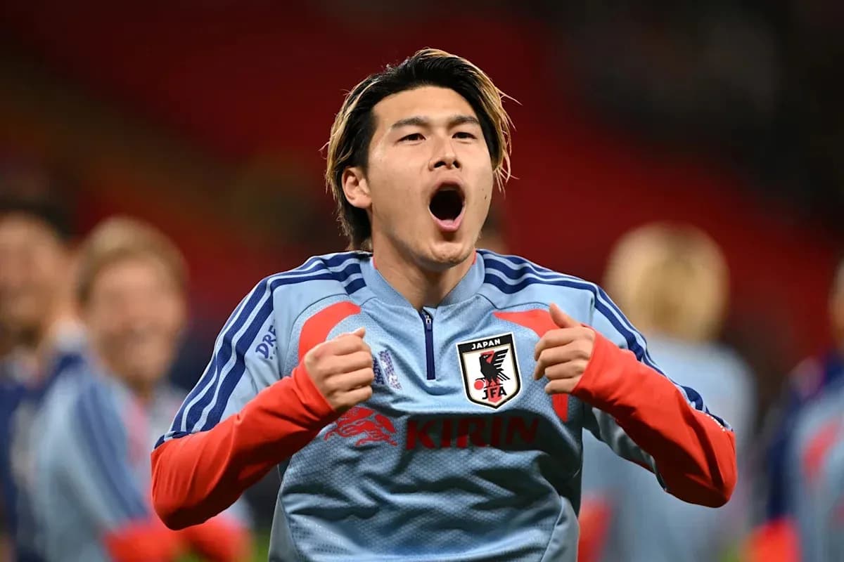 Player celebrating in Japan national team kit Player celebrating in Japan national team kit