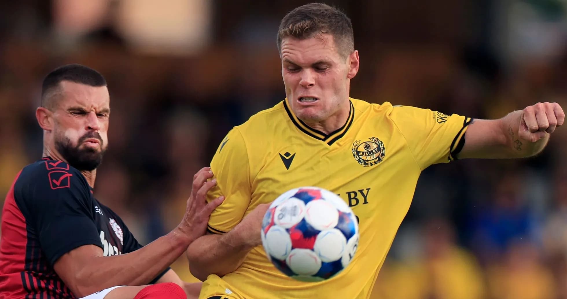 Mjallby player challenging for the ball Mjallby player challenging for the ball