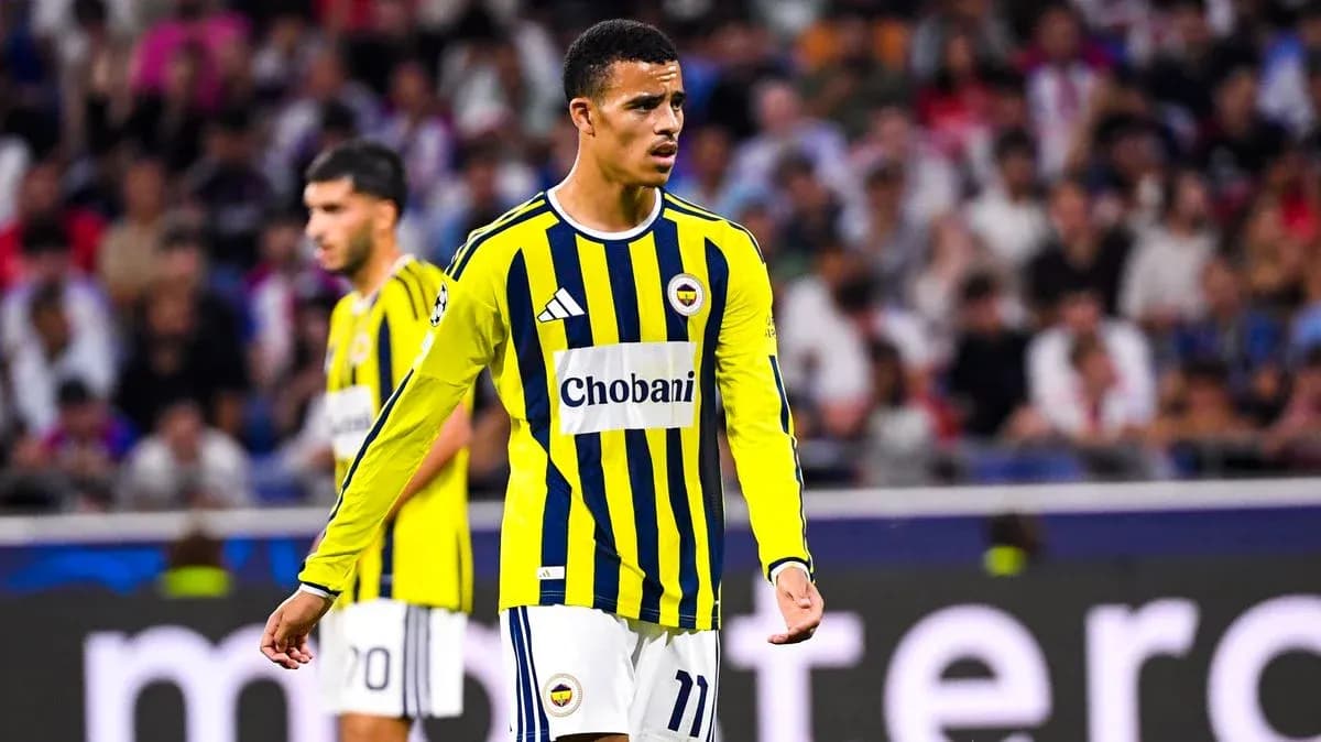 Fenerbahçe player in yellow and blue kit during match Fenerbahçe player in yellow and blue kit during match