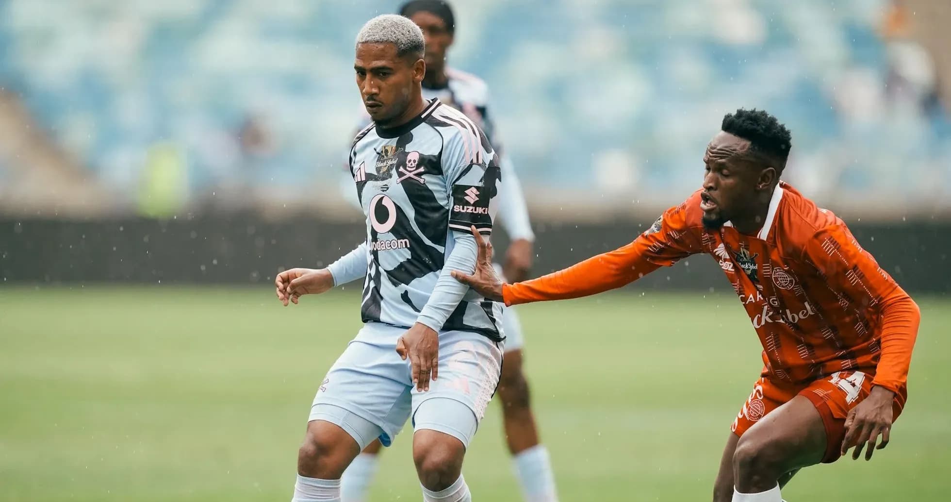 Player dribbling while being challenged by opponent Player dribbling while being challenged by opponent