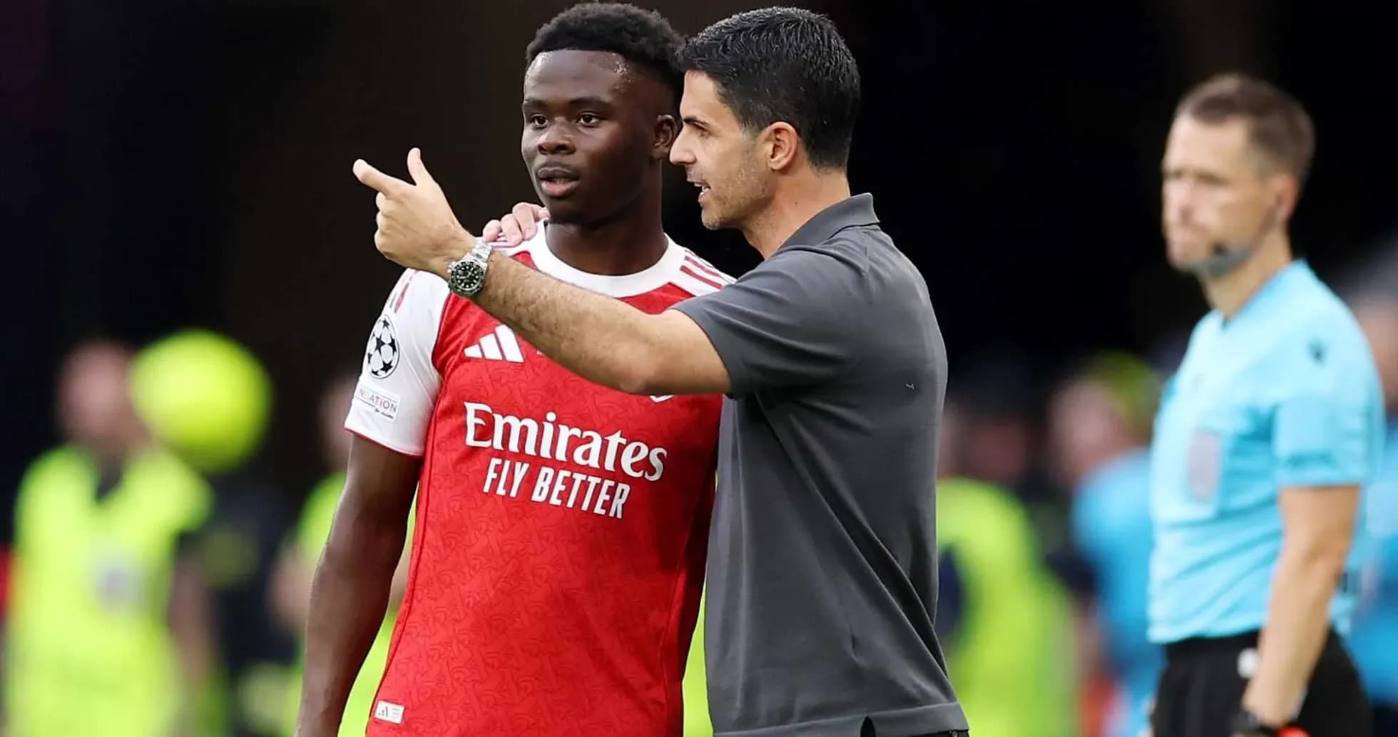 Manager discussing tactics with player during match Manager discussing tactics with player during match
