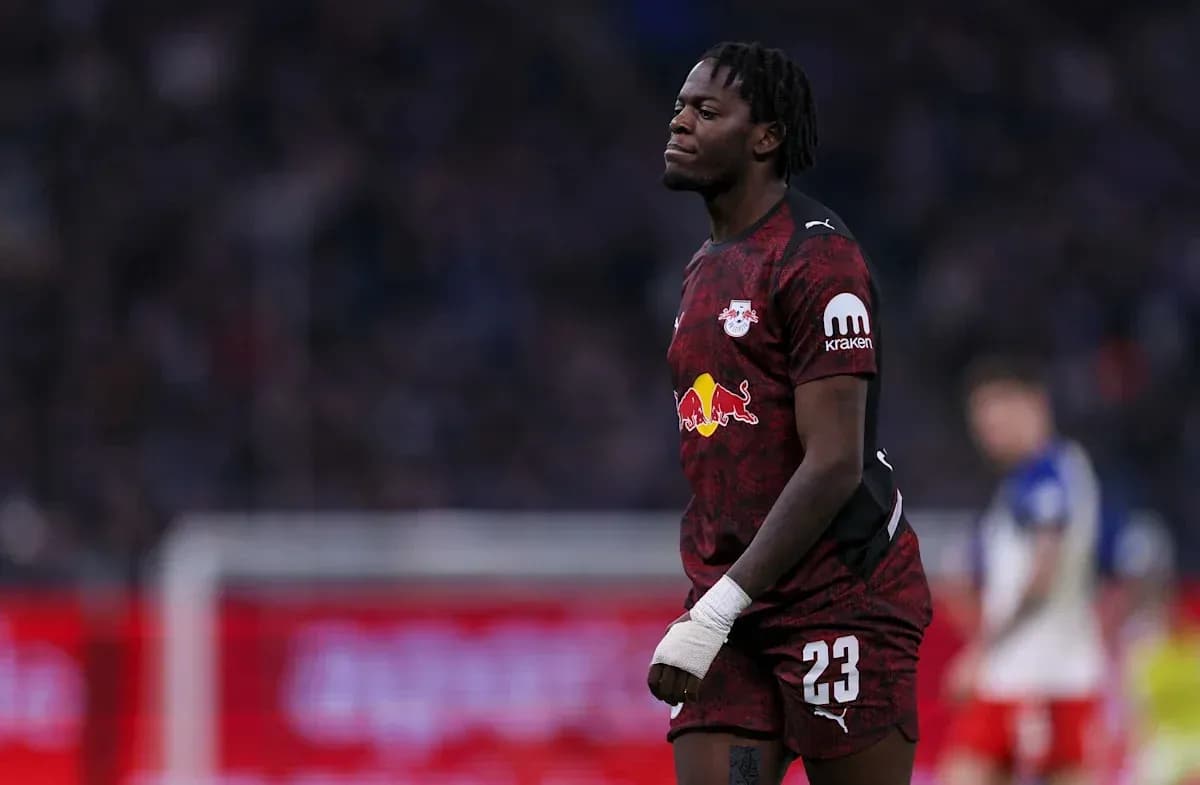 Player wearing RB Leipzig kit walking on field Player wearing RB Leipzig kit walking on field