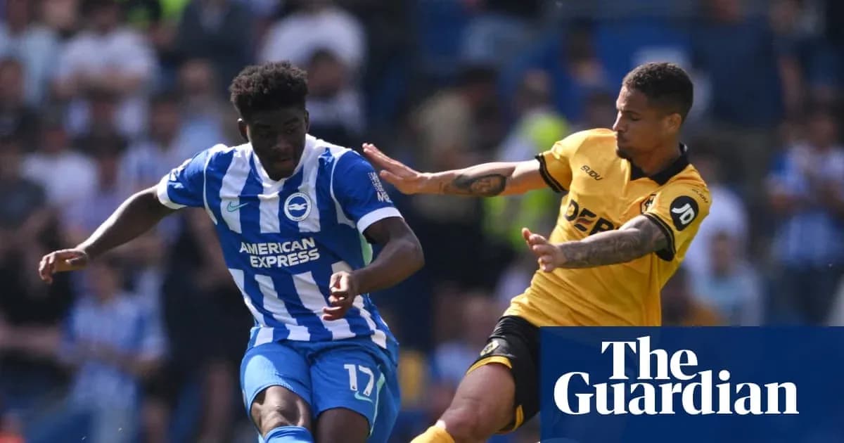 Brighton player dribbling past opposing defender during match Brighton player dribbling past opposing defender during match