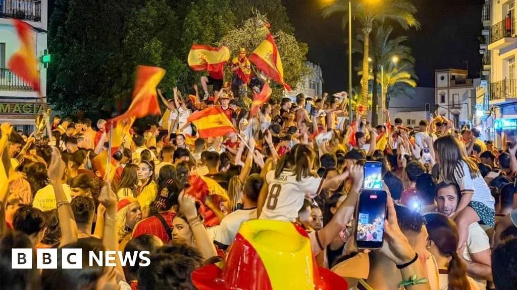 Crowd celebrating with flags in night street Crowd celebrating with flags in night street