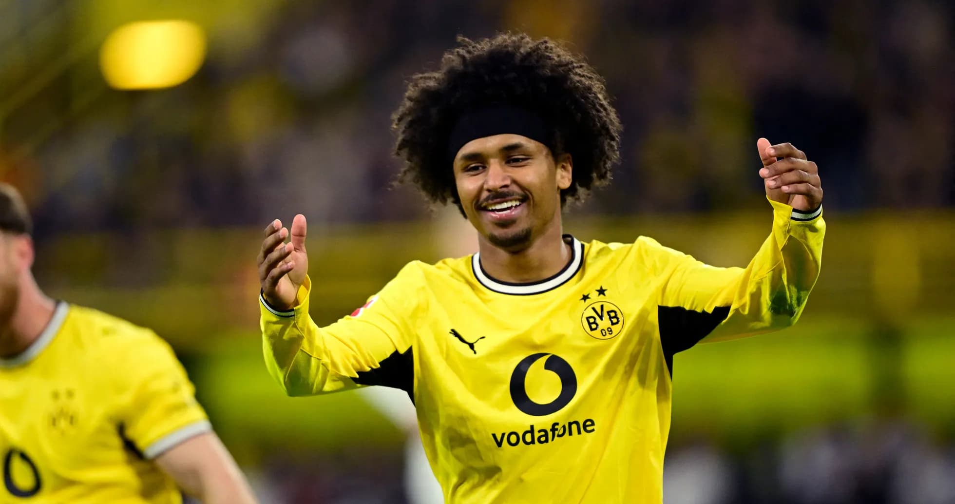 Player celebrating in Borussia Dortmund jersey Player celebrating in Borussia Dortmund jersey
