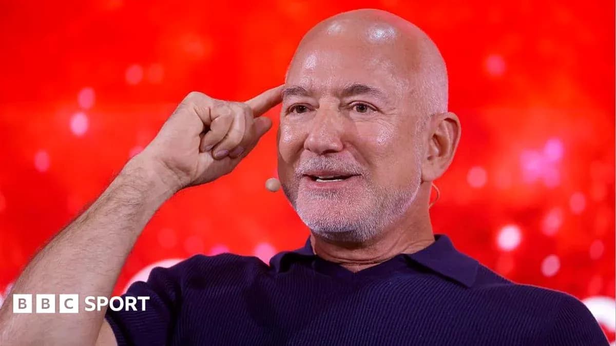 Speaker gesturing during a discussion on stage Speaker gesturing during a discussion on stage