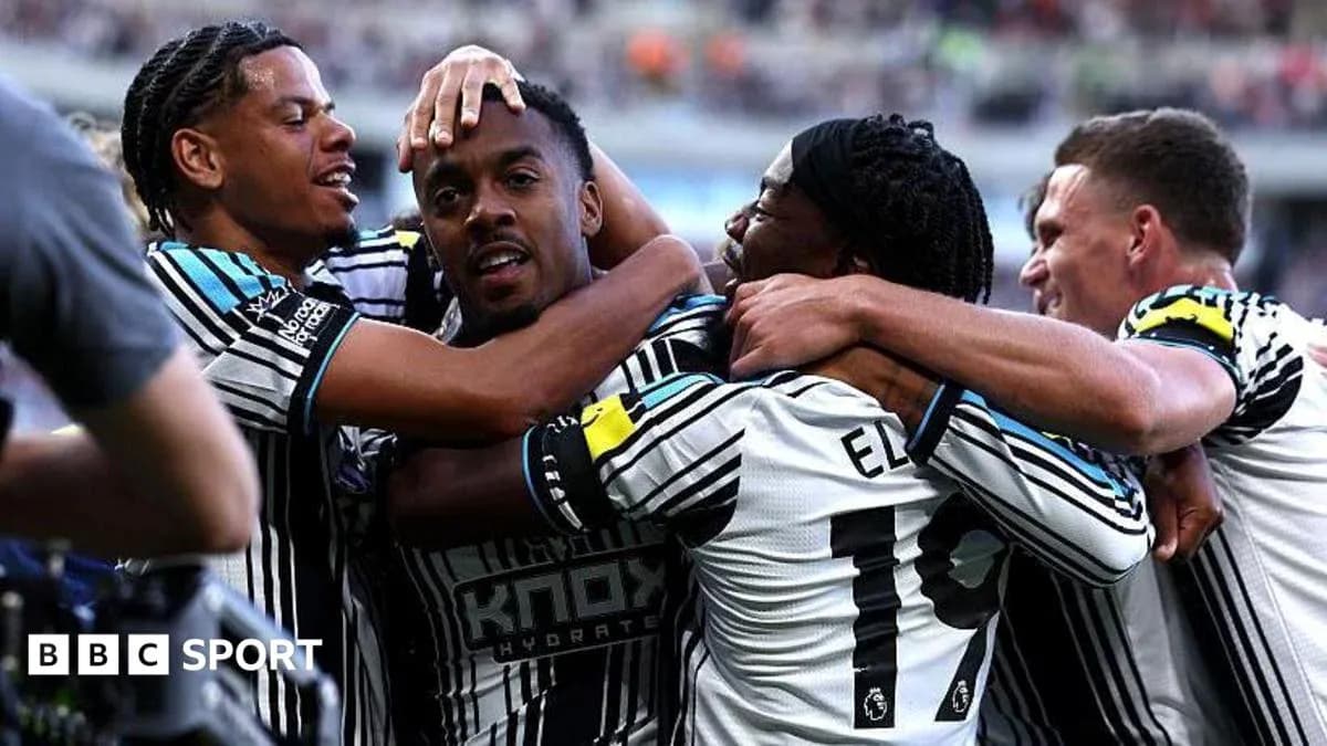 Players celebrating a goal during a match Players celebrating a goal during a match