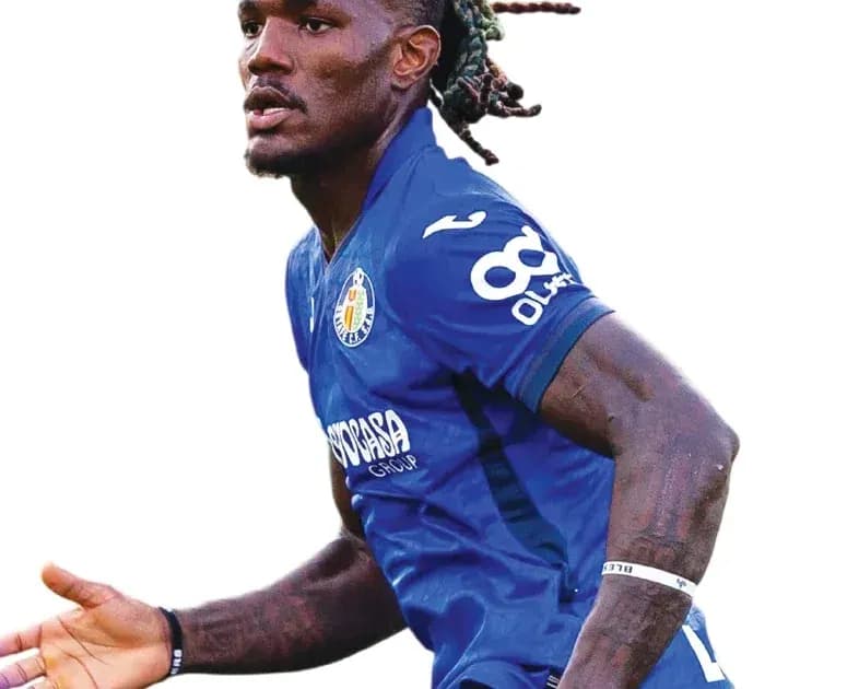 Player celebrating in blue jersey during match Player celebrating in blue jersey during match