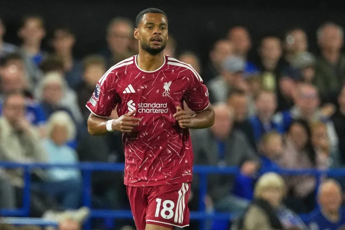 Liverpool player in red kit during match action Liverpool player in red kit during match action