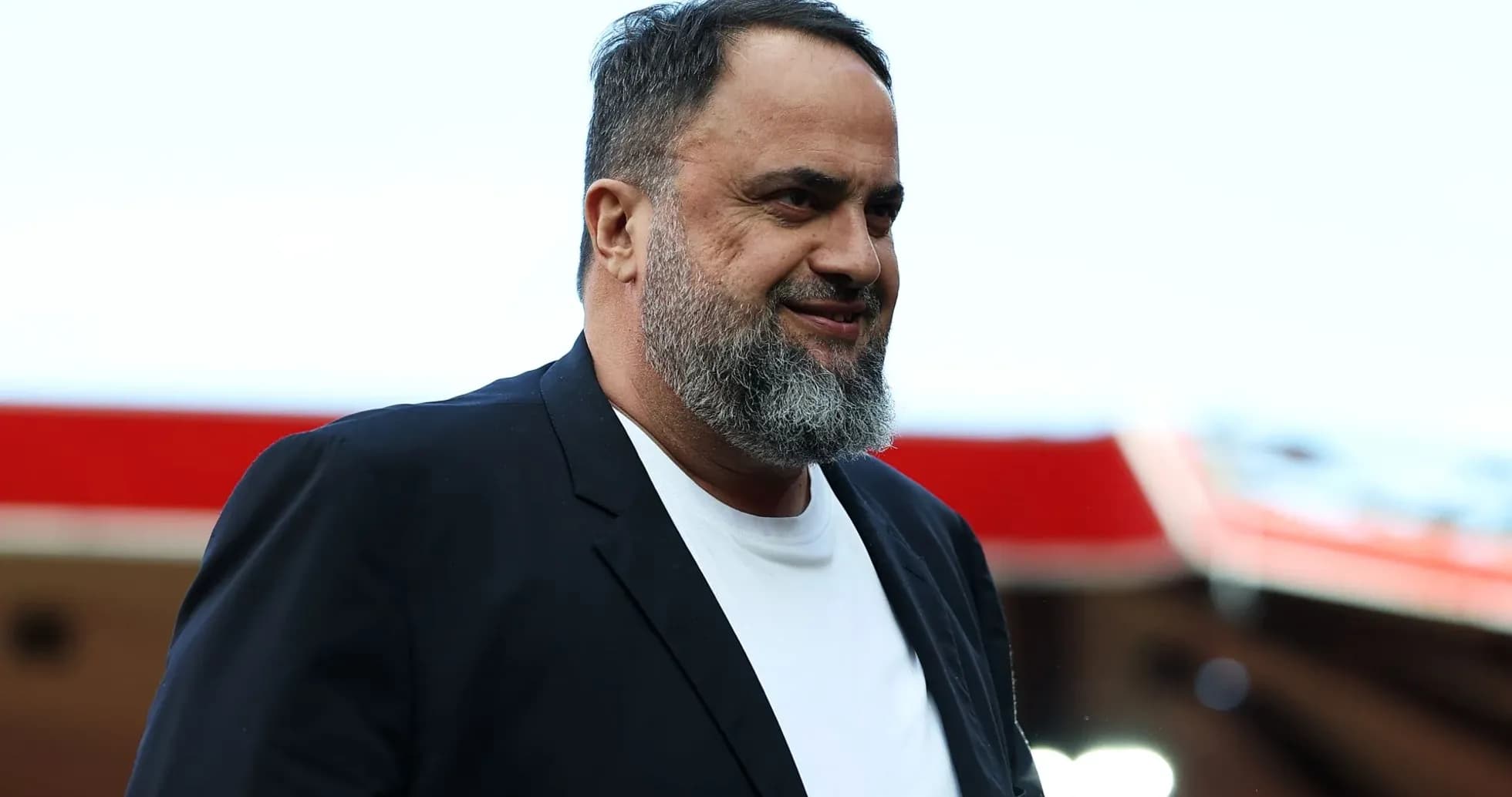Man in black jacket smiling at event Man in black jacket smiling at event