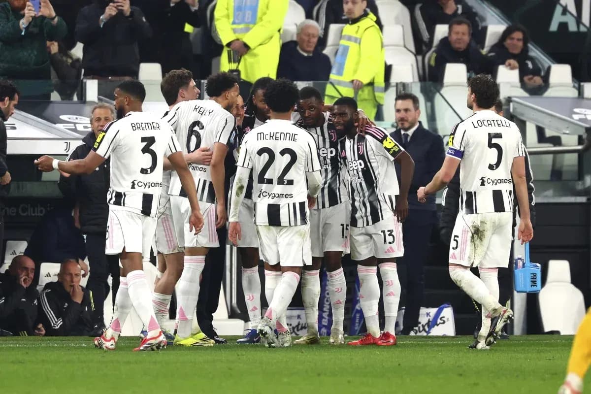 Juventus players celebrating a goal on the field Juventus players celebrating a goal on the field