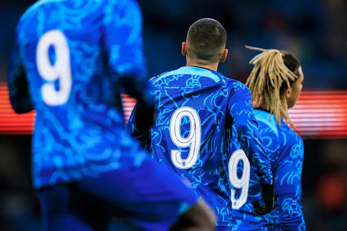 Players wearing blue jerseys with number 9 visible Players wearing blue jerseys with number 9 visible