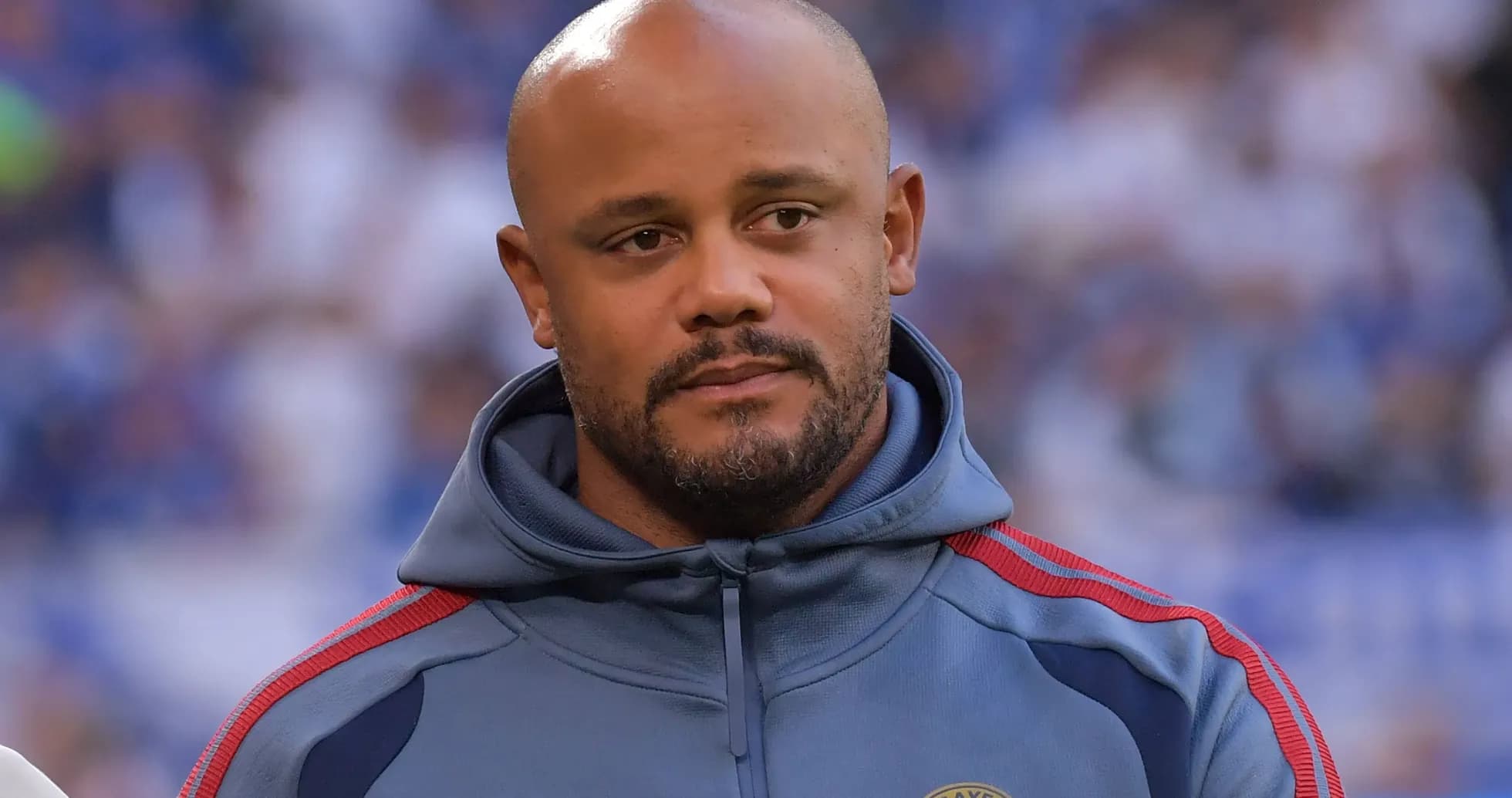 Coach in FC Bayern Munich tracksuit on field Coach in FC Bayern Munich tracksuit on field