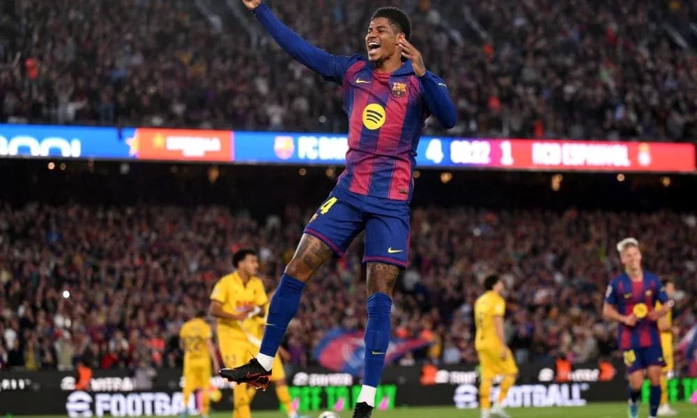Barcelona player celebrating goal in packed stadium Barcelona player celebrating goal in packed stadium