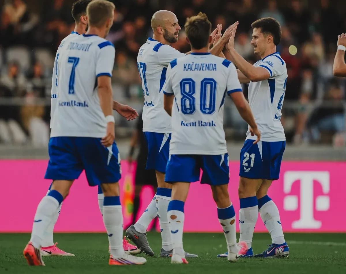 Players celebrating a goal during football match Players celebrating a goal during football match