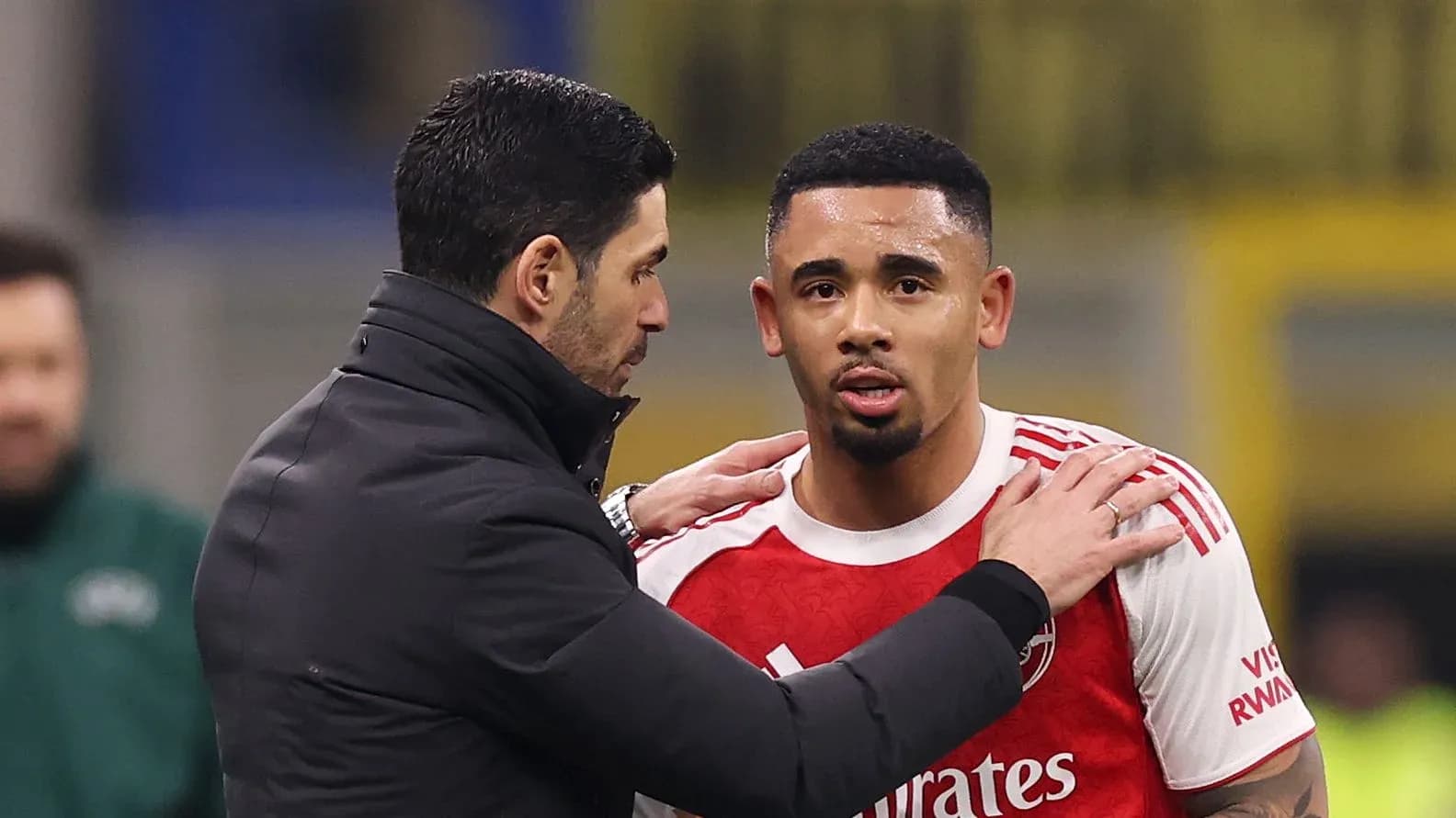 Manager speaking to player during match substitution Manager speaking to player during match substitution