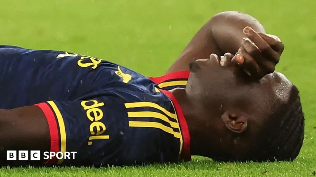 Player lying on the ground during a match Player lying on the ground during a match