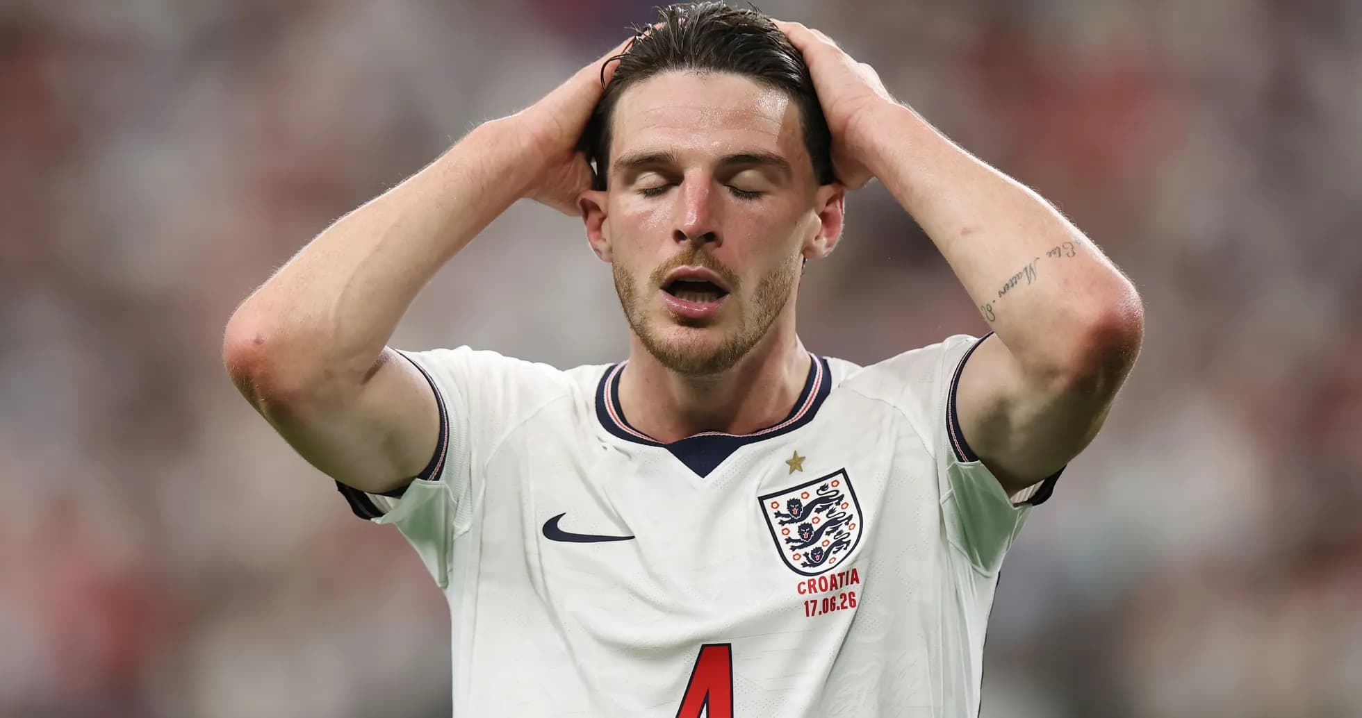 Player in England kit showing frustration on the field Player in England kit showing frustration on the field
